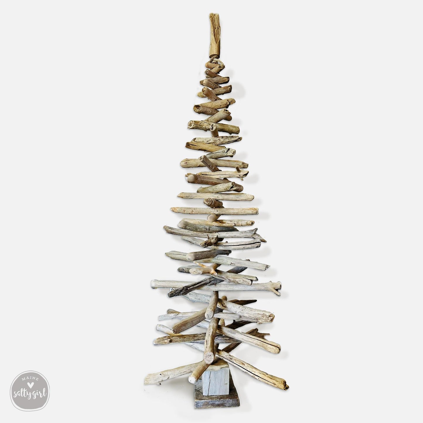 a wooden christmas tree made out of driftwood