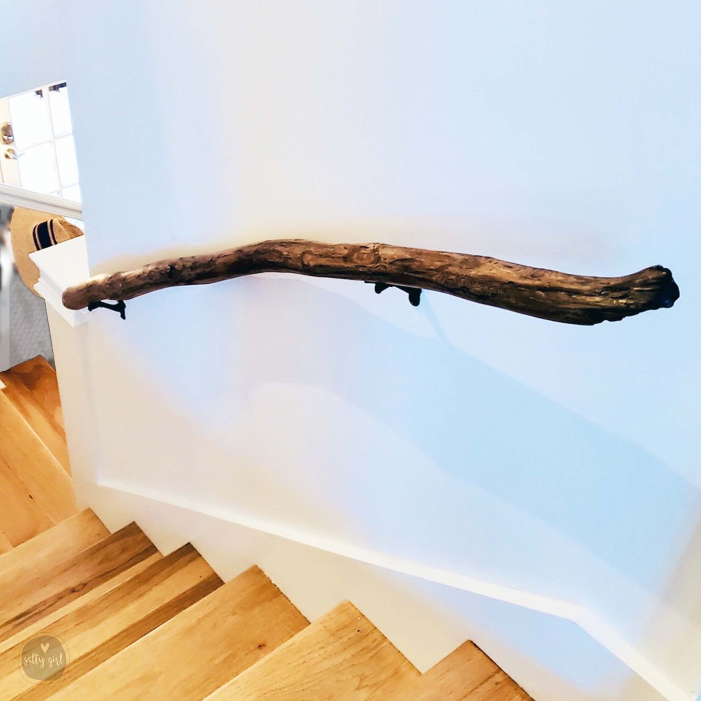Driftwood handrail installed on staircase