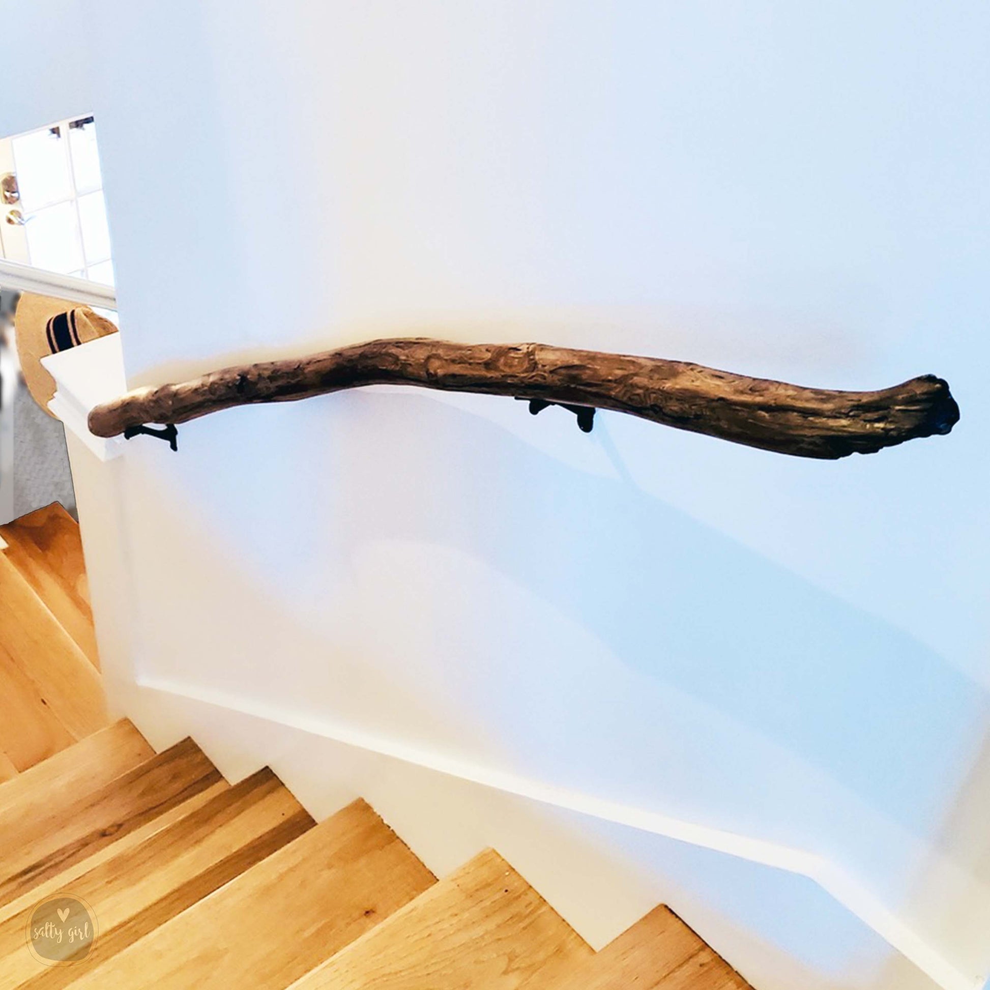 Driftwood handrail installed on staircase
