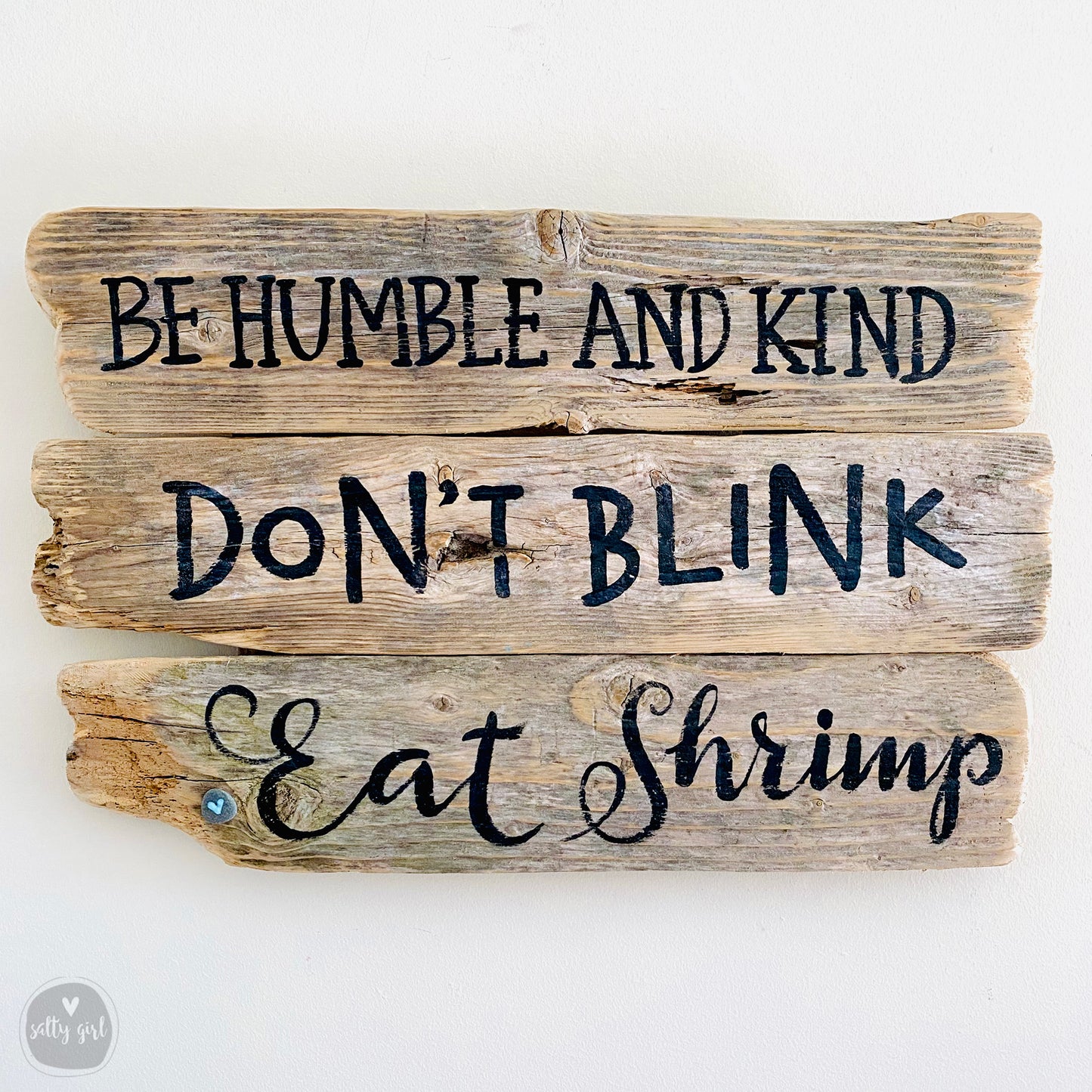 a wooden sign that says be humble and kind don't blink eat shrimp