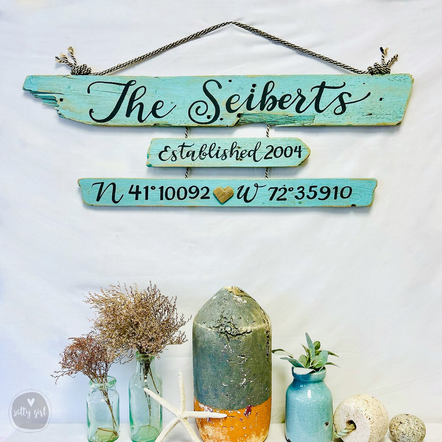 a group of vases sitting next to a sign