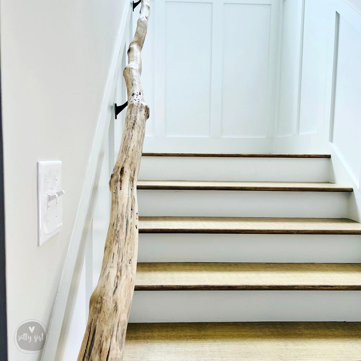 Driftwood handrail installed on staircase