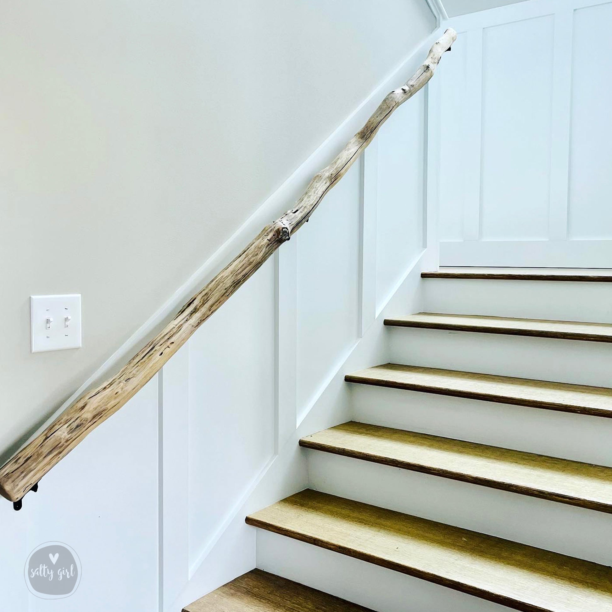 Driftwood handrail installed on staircase