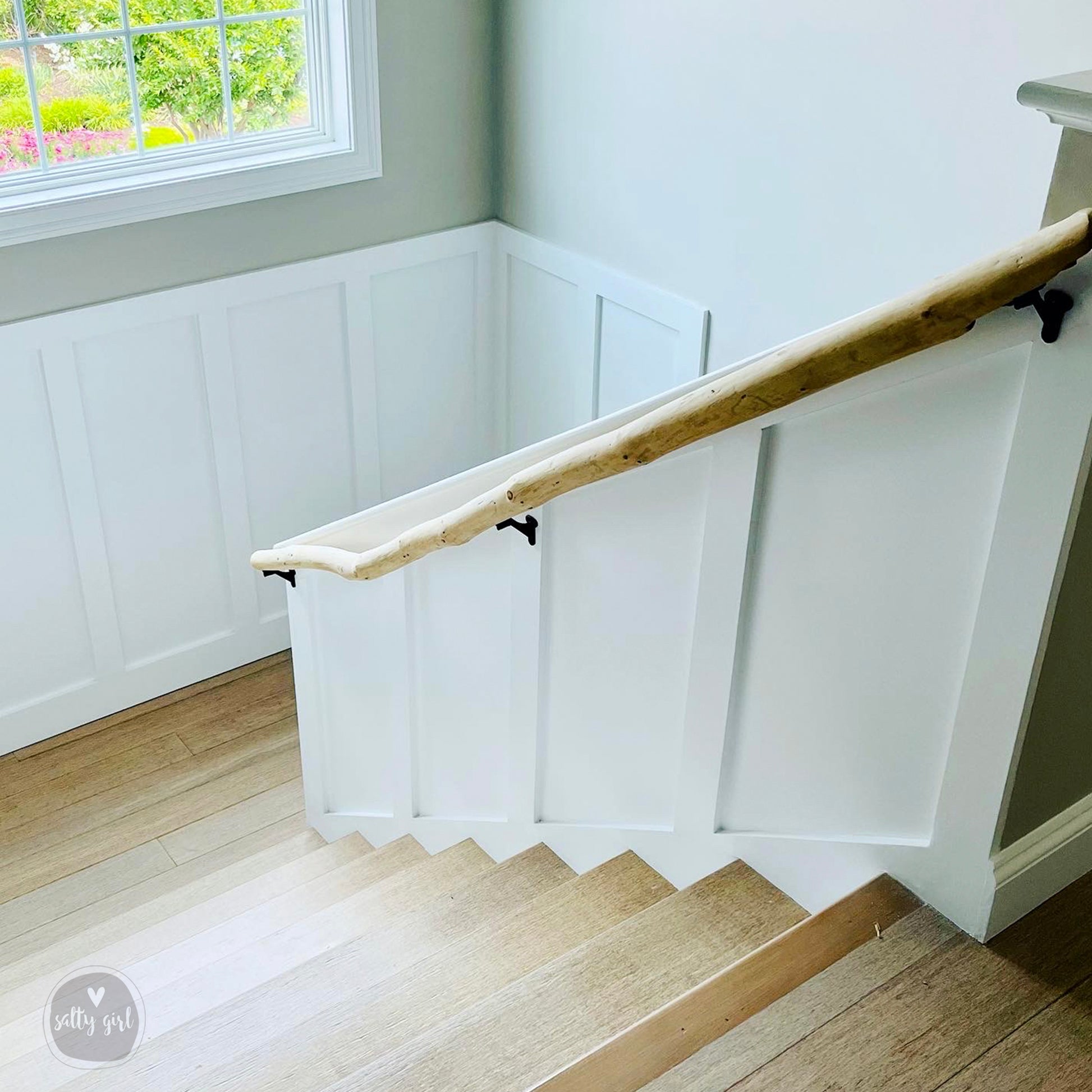 Driftwood handrail installed on staircase