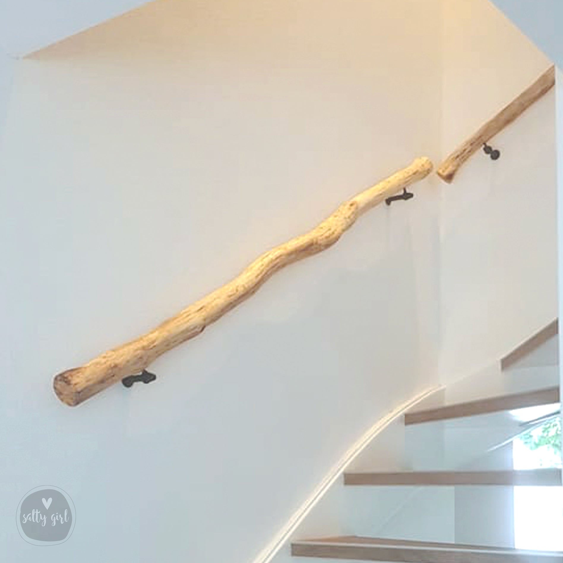 Driftwood handrail installed on staircase