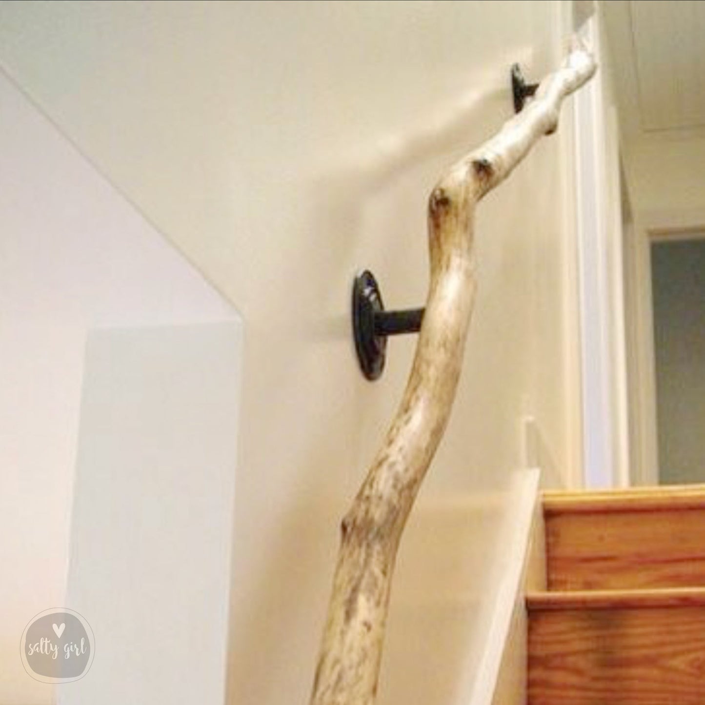 Driftwood handrail installed on staircase