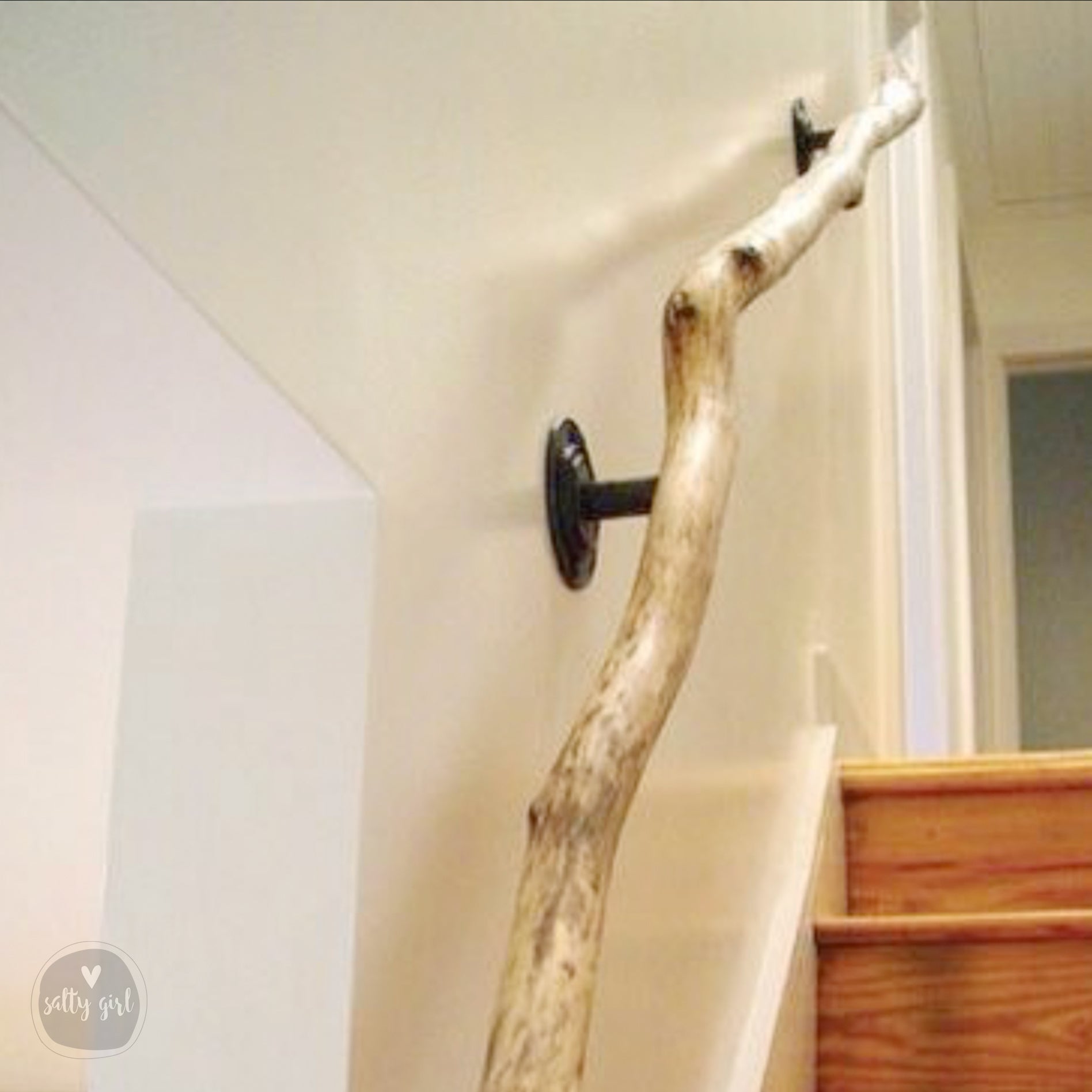 Driftwood handrail installed on staircase