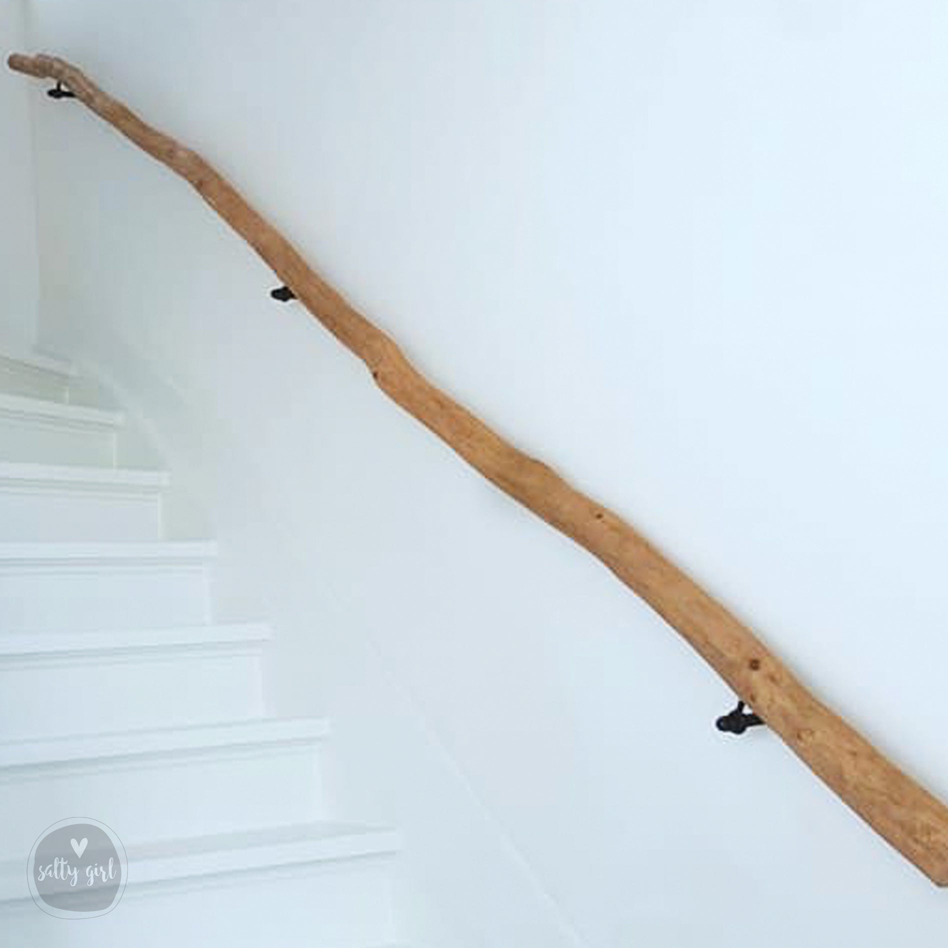 Driftwood handrail installed on staircase