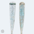 a pair of wooden paddles sitting next to each other