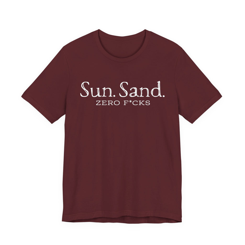 A burgundy-colored t-shirt with the text "Sun. Sand. Zero F*cks" printed on it.