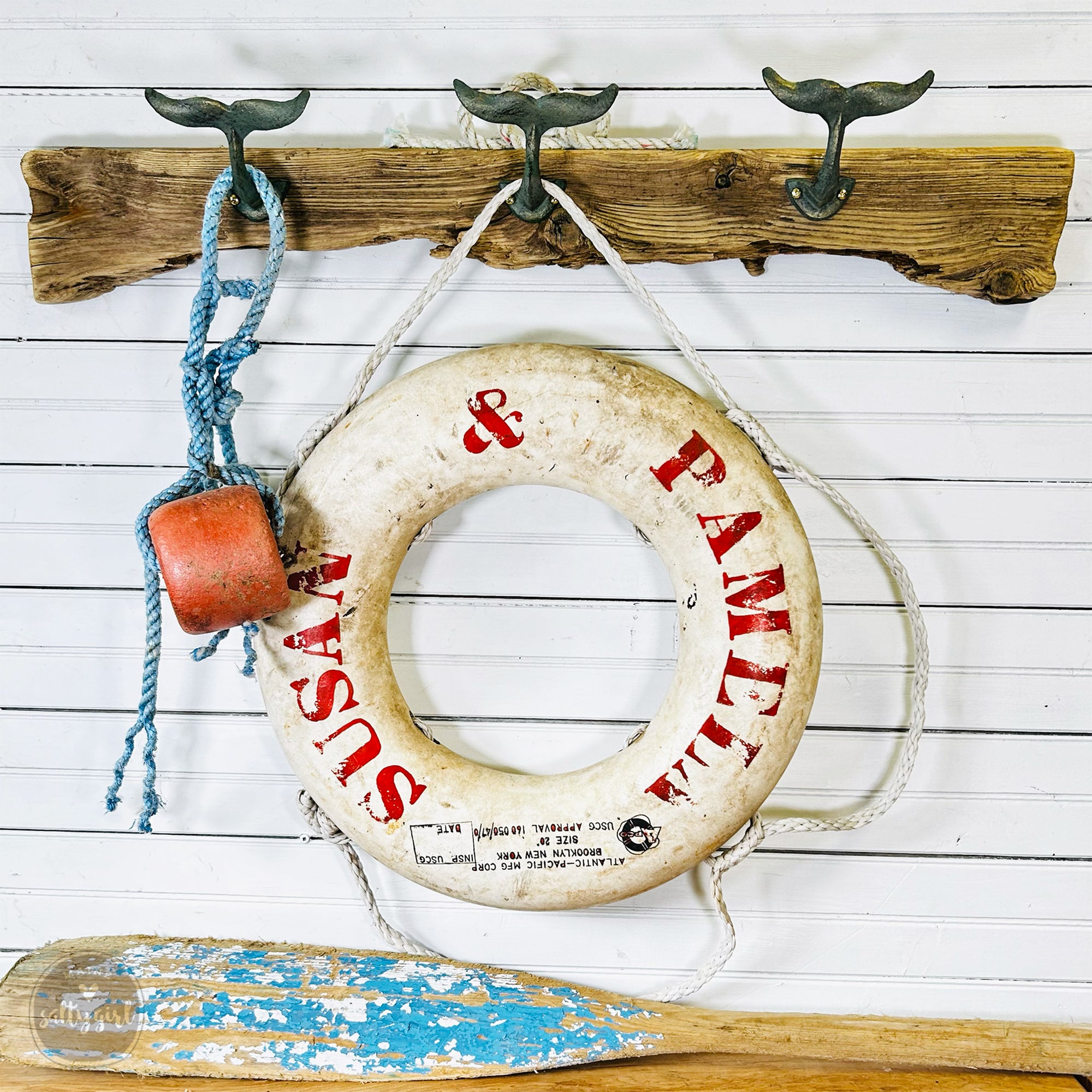 a life preserver hanging on a wall