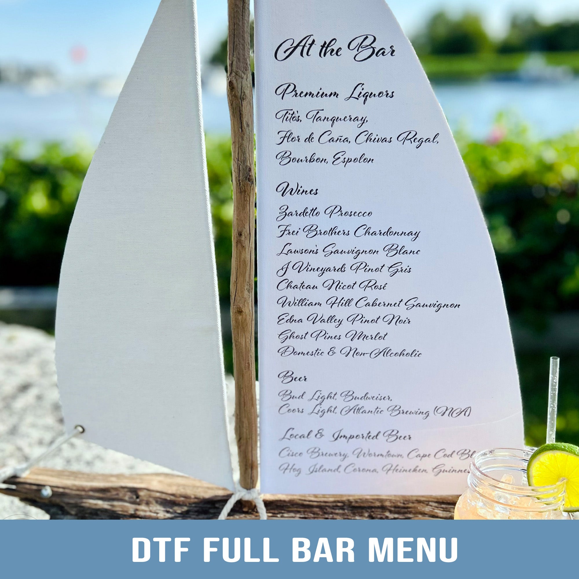 a full bar menu with a sailboat in the background, suggesting a nautical or beach-themed setting.