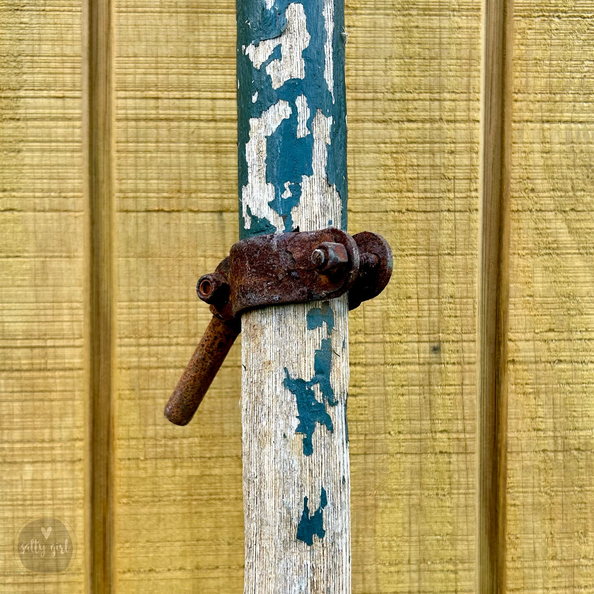 an old rusty lock on a wooden door