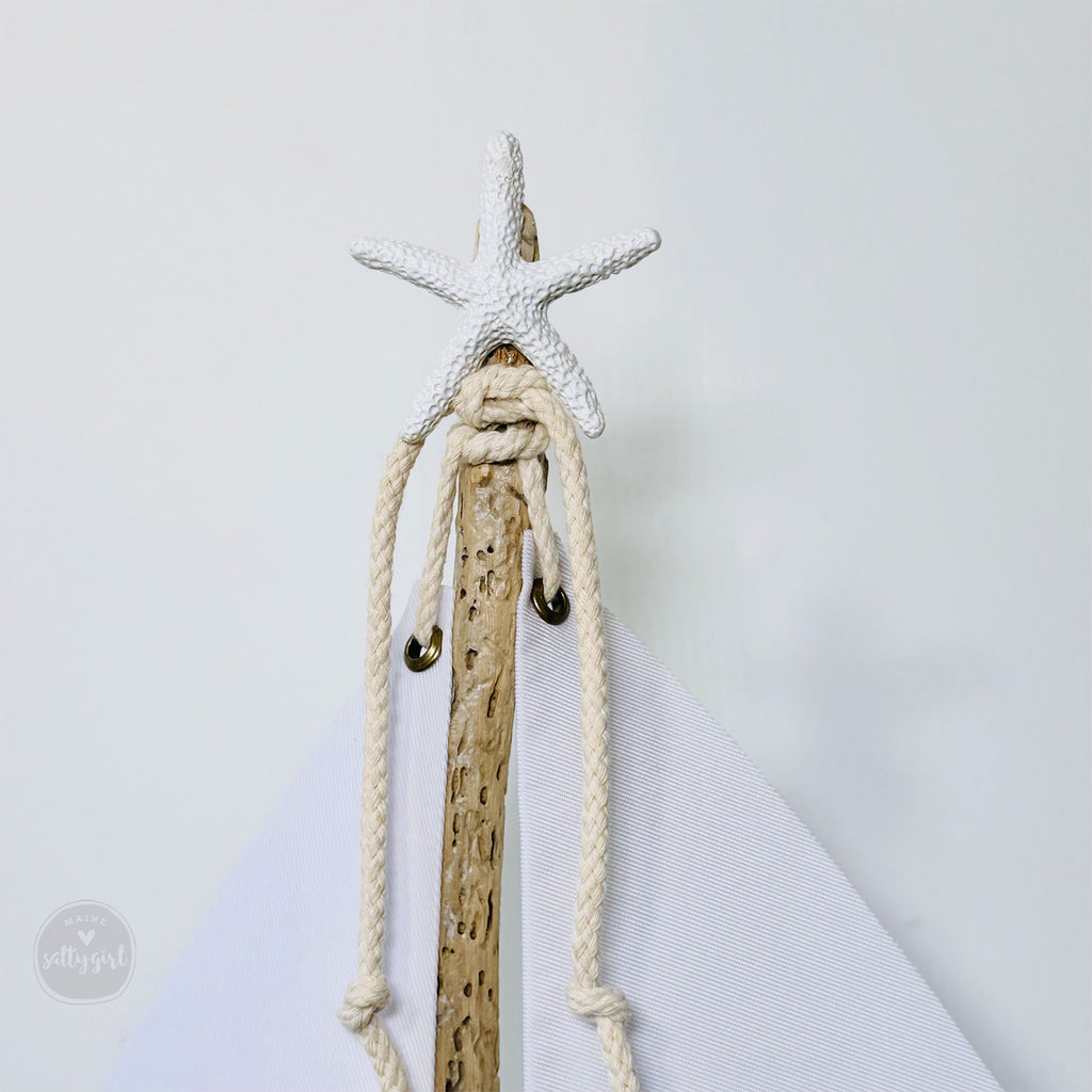 a wooden stick with a starfish on top of it