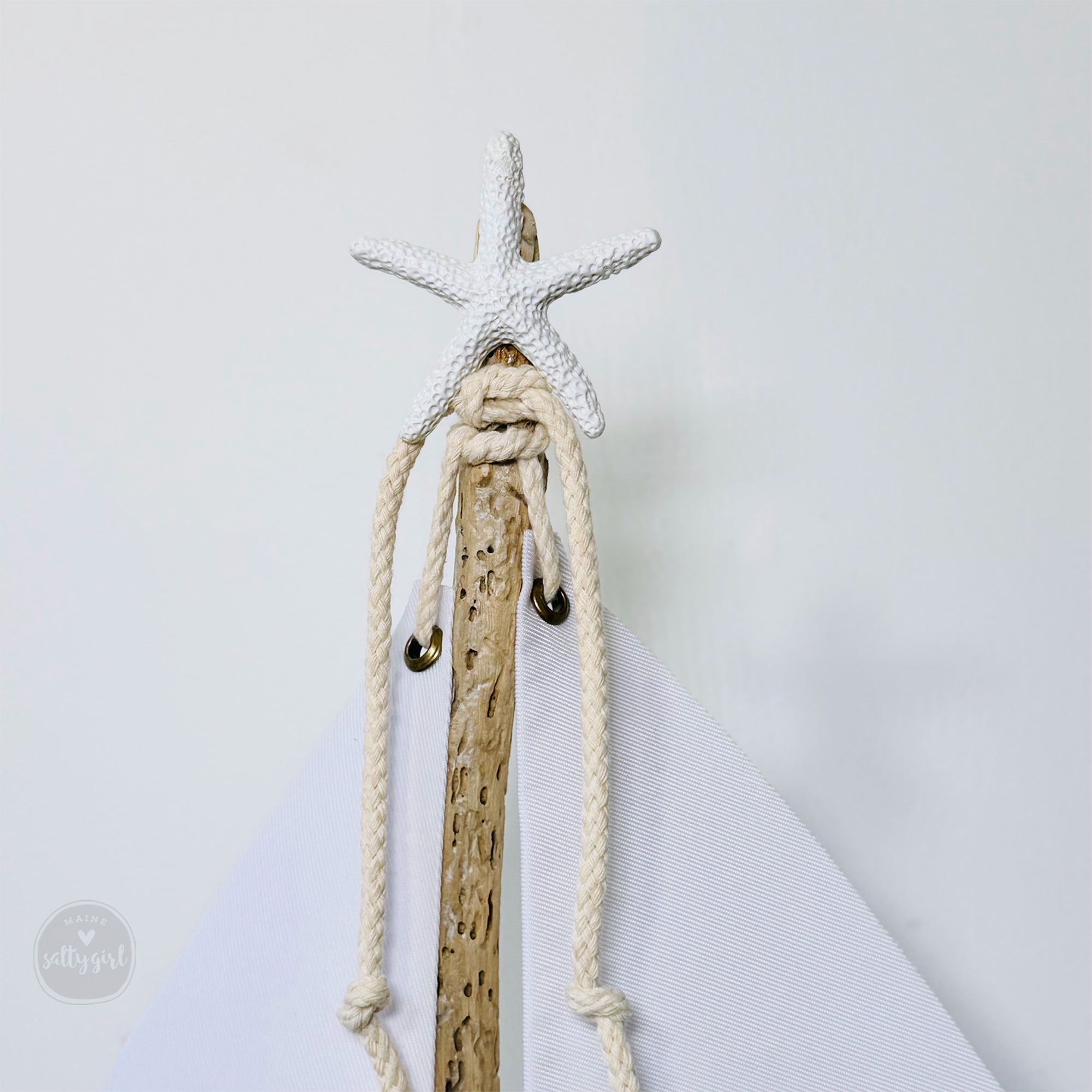 a wooden stick with a starfish on top of it