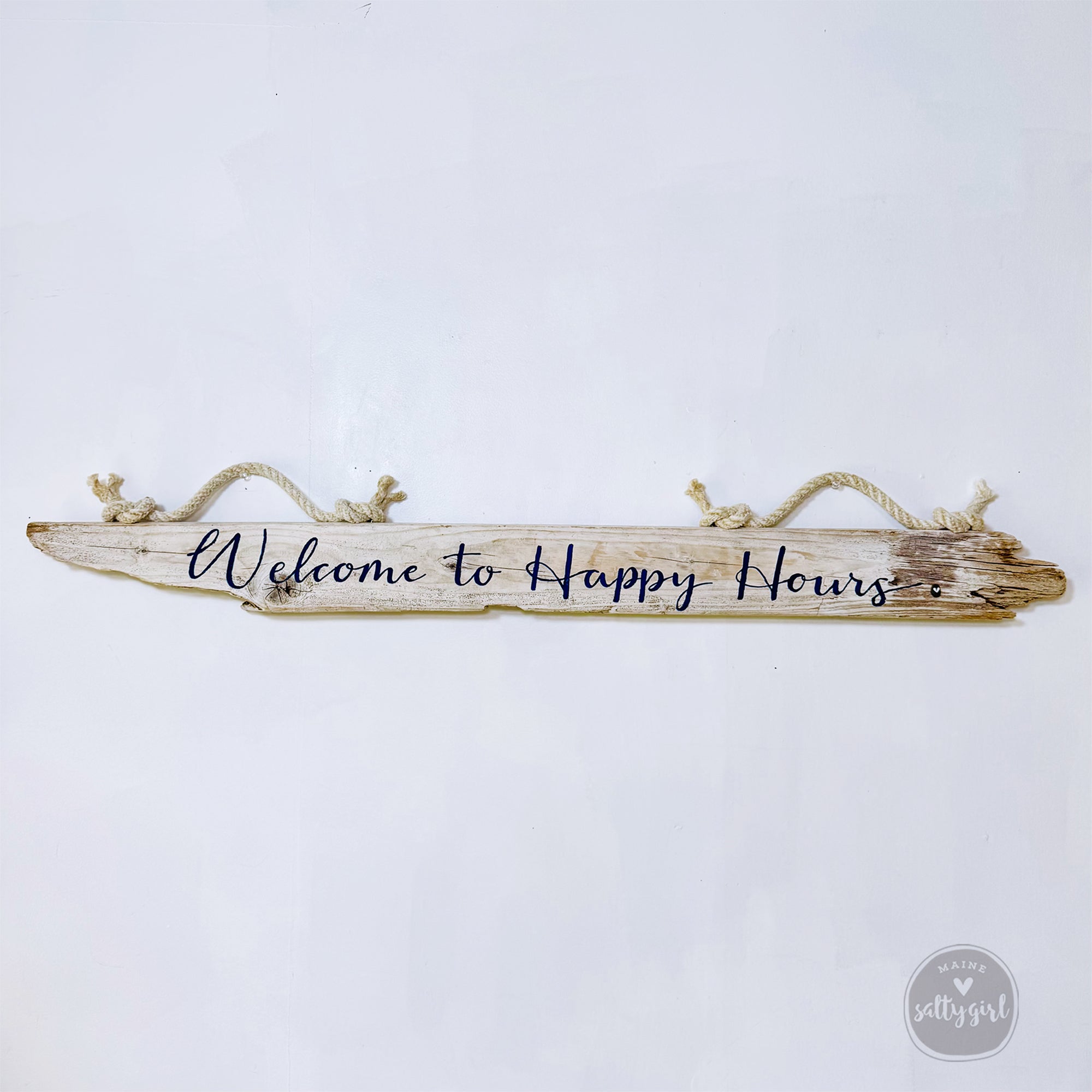 A wooden sign with the text "Welcome to Happy Hours" written on it.