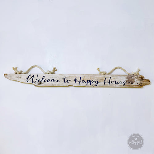 A wooden sign with the text "Welcome to Happy Hours" written on it.