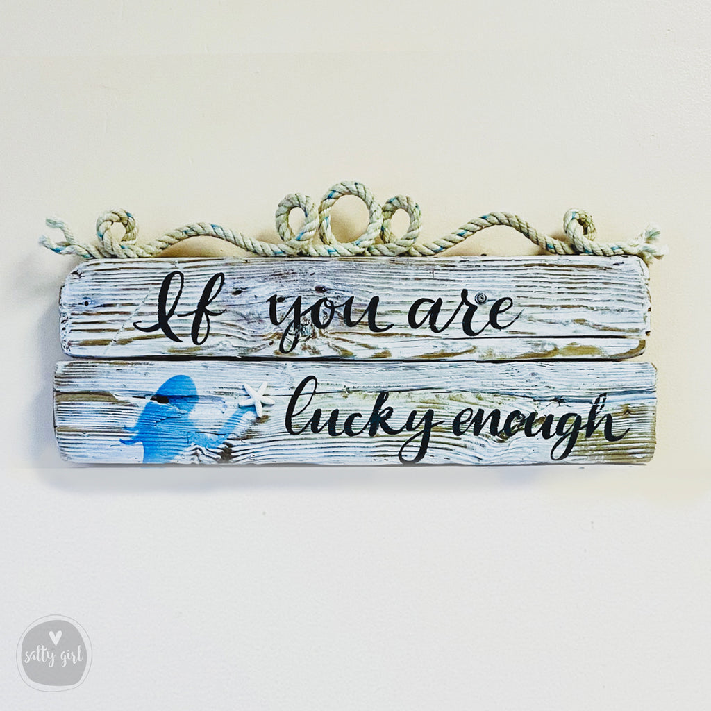 a wooden sign with the text "If you are lucky enough" written on it.