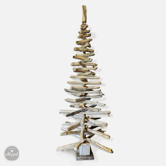 a wooden christmas tree made out of driftwood