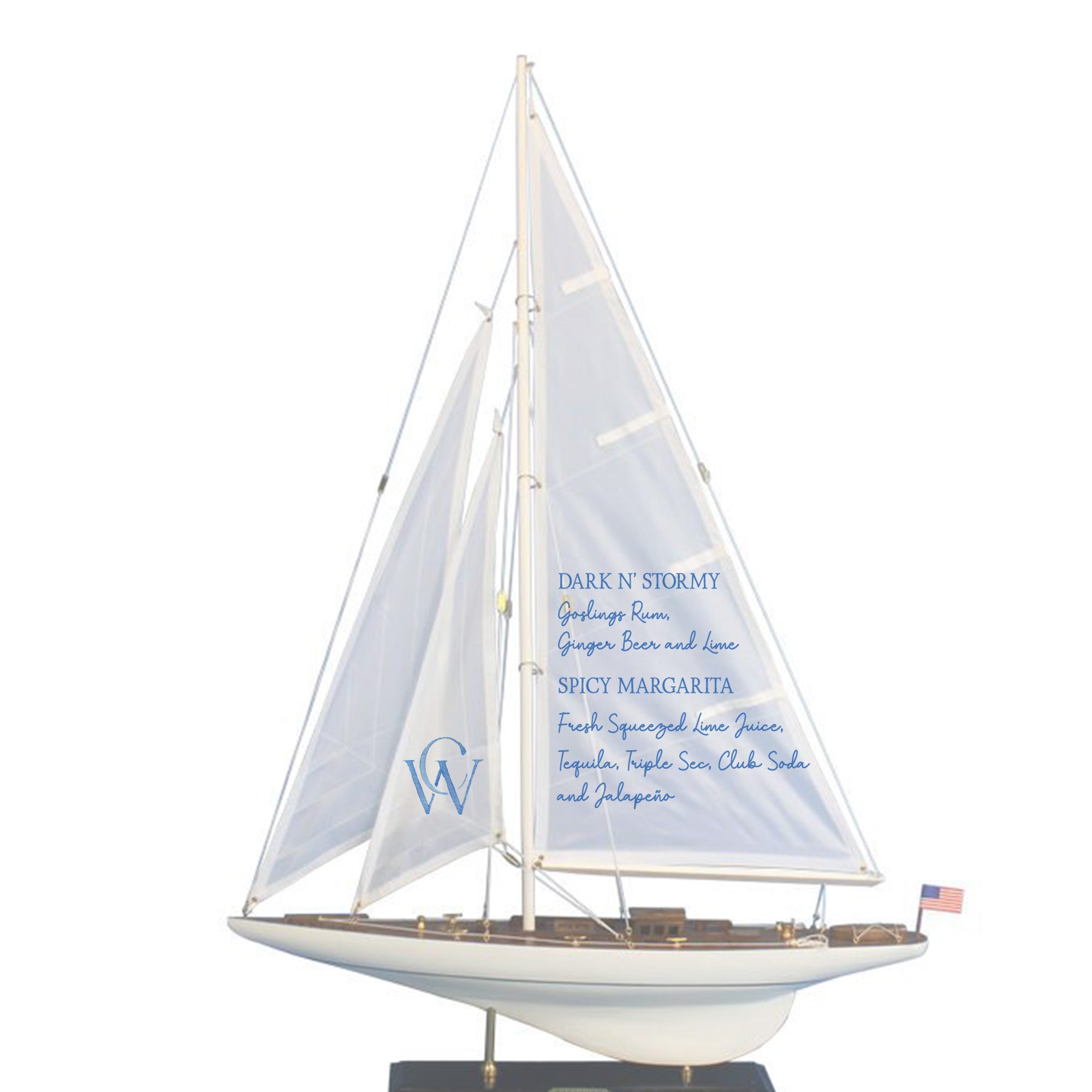 A model of a sailboat with a white sail and blue text on it.