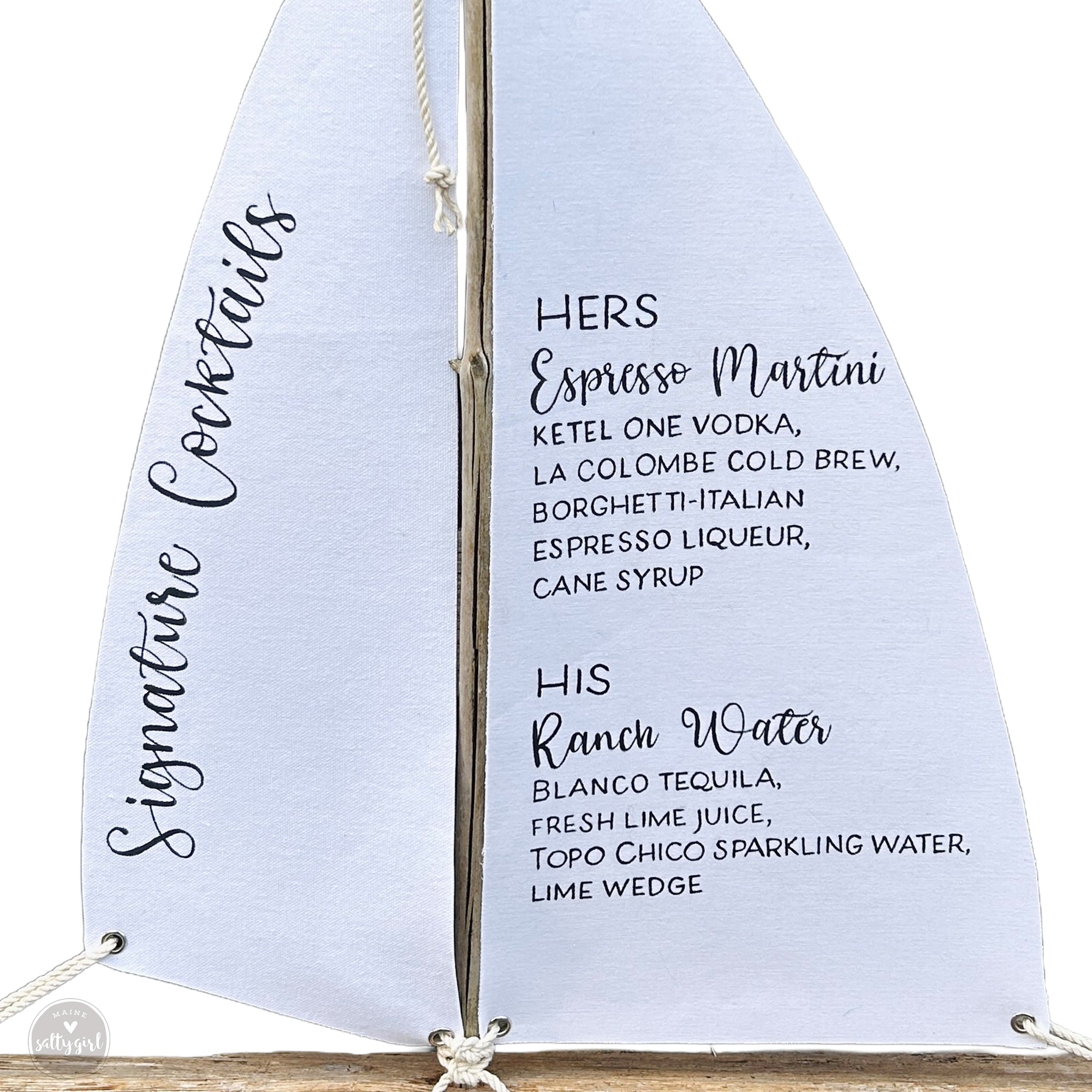 A white sailboat with black text listing cocktail names and descriptions.