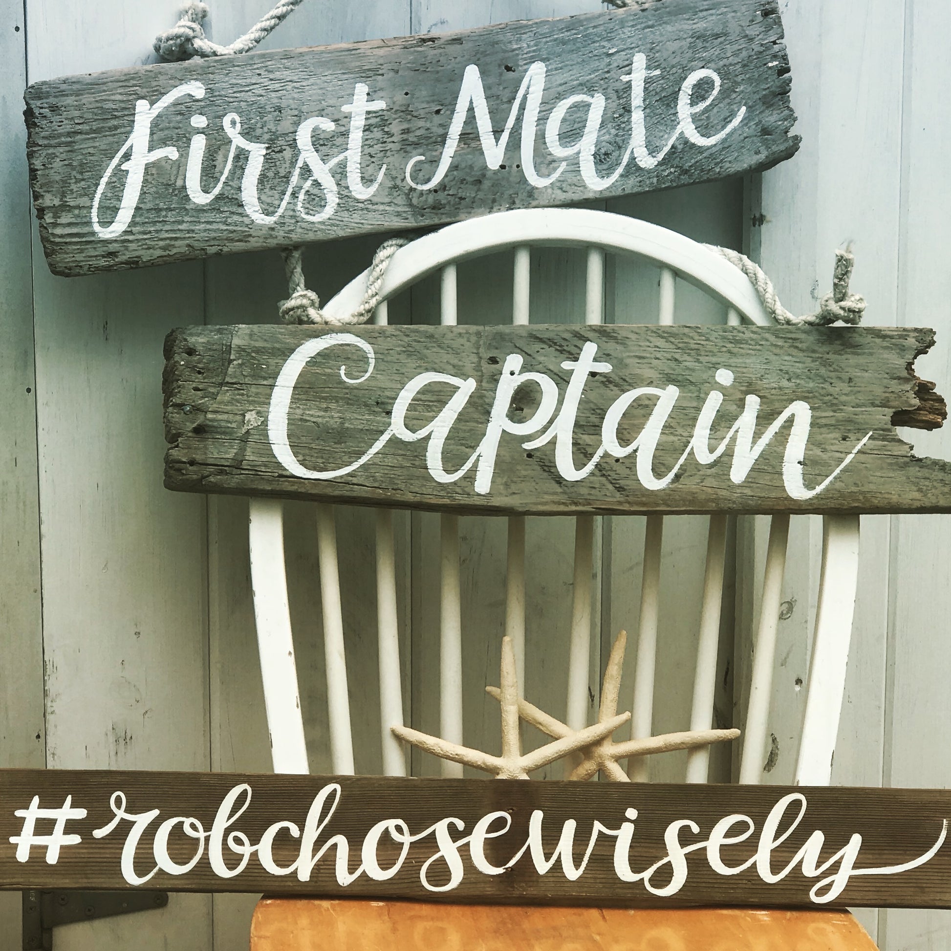 a wooden sign that says first mate captain and a wood chair