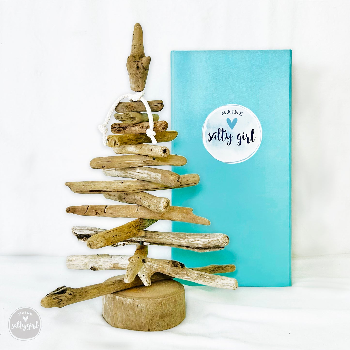 a wooden christmas tree made out of driftwood