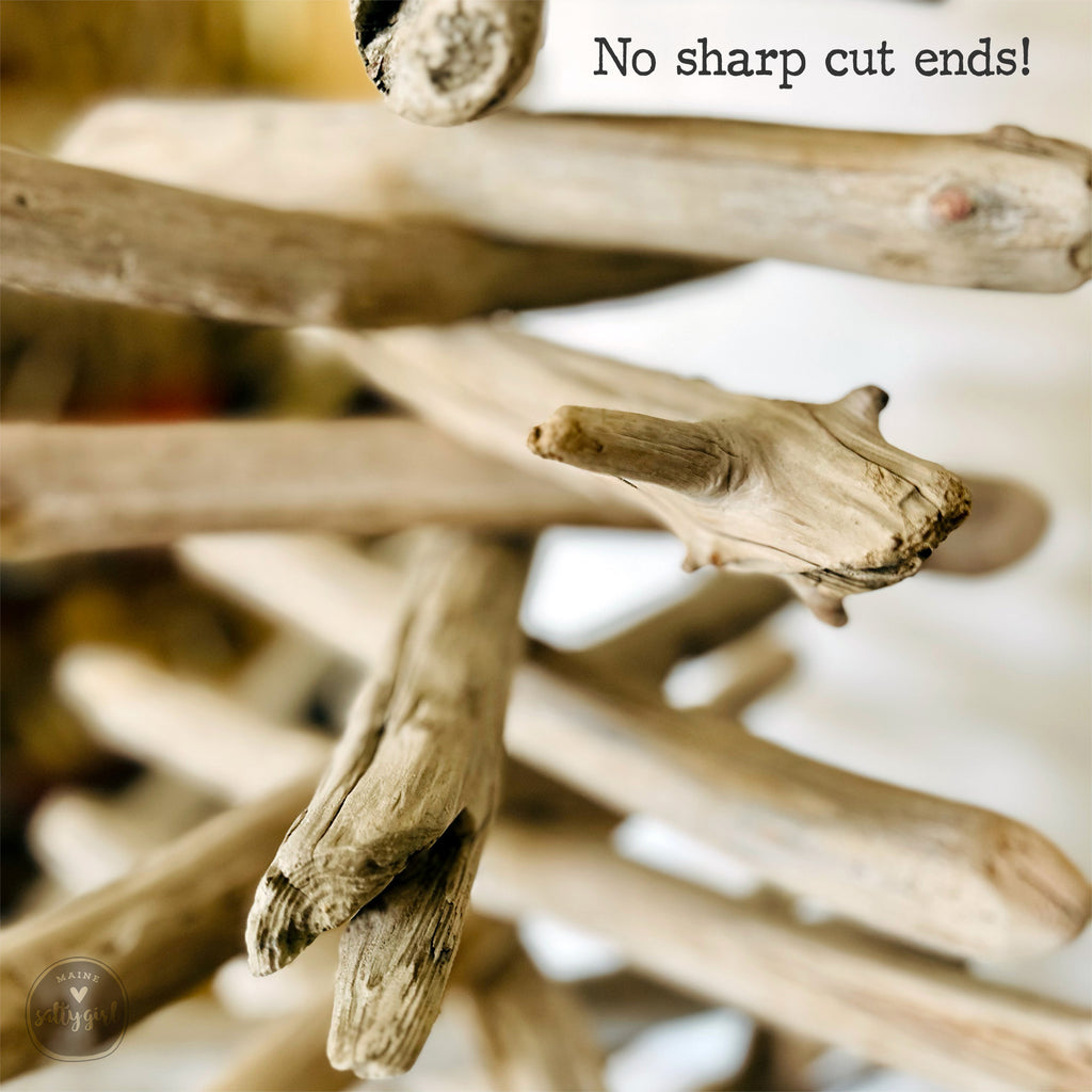a close-up view of a pile of wooden sticks or branches, with the text "No sharp cut ends!" superimposed on the image.