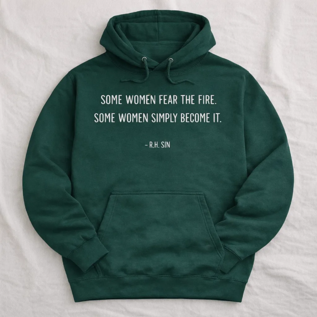 A dark green hoodie with a quote printed on it.