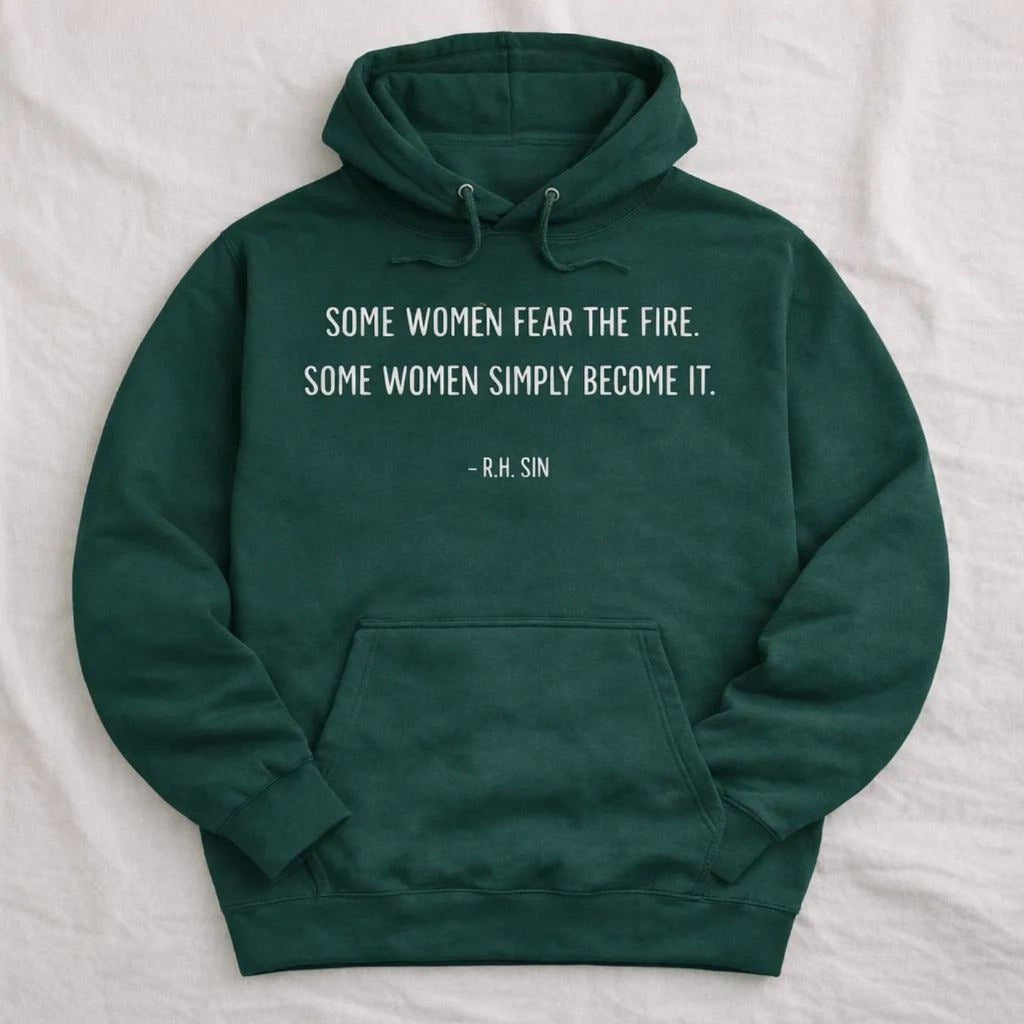 A dark green Maine Salty Girl hoodie with a quote printed on it.