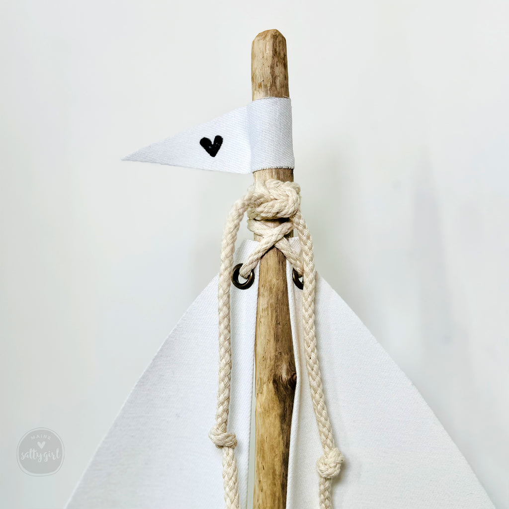 a wooden stick with a knot tied around it