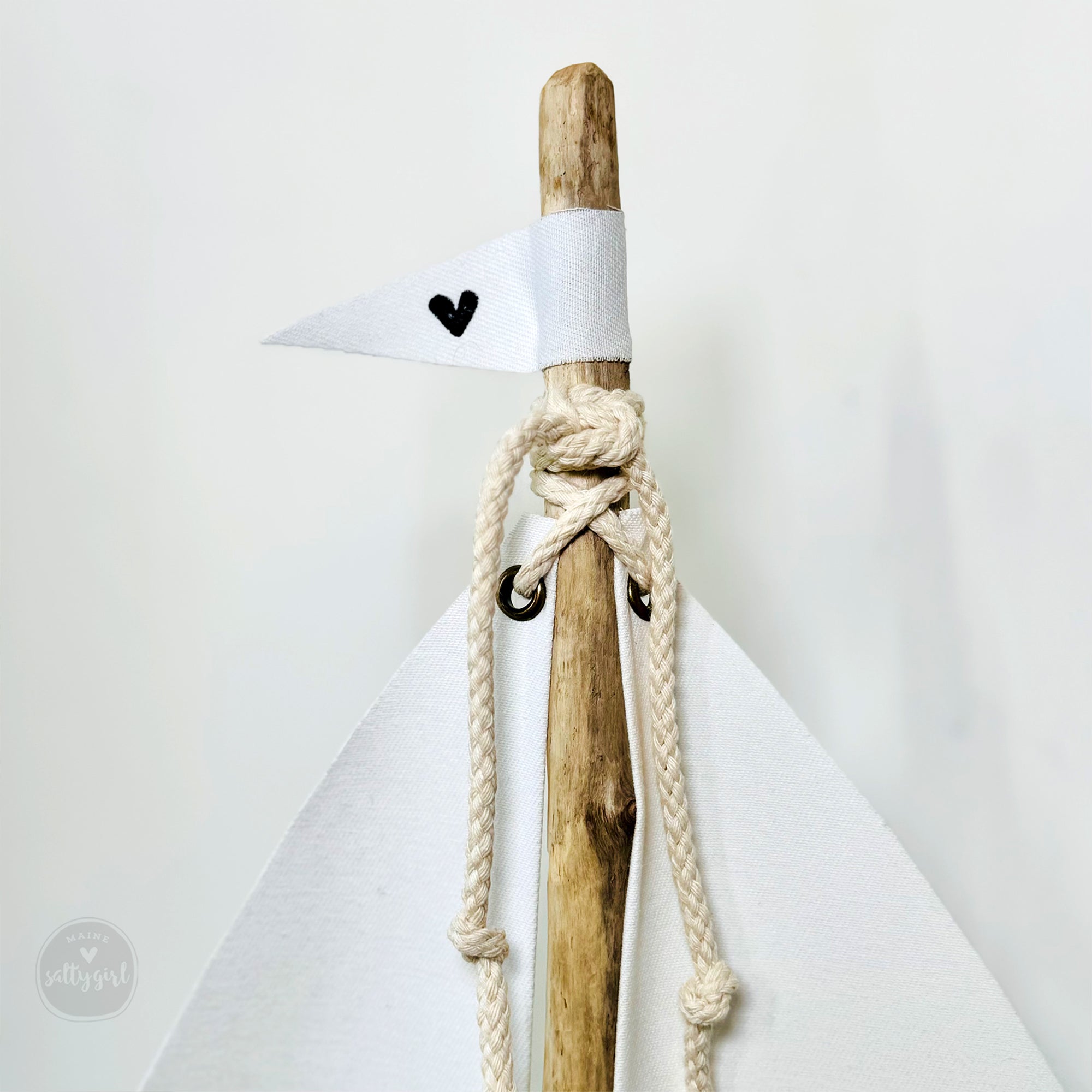 a wooden stick with a knot tied around it