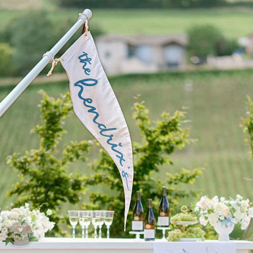 a table with a flag and wine glasses on it