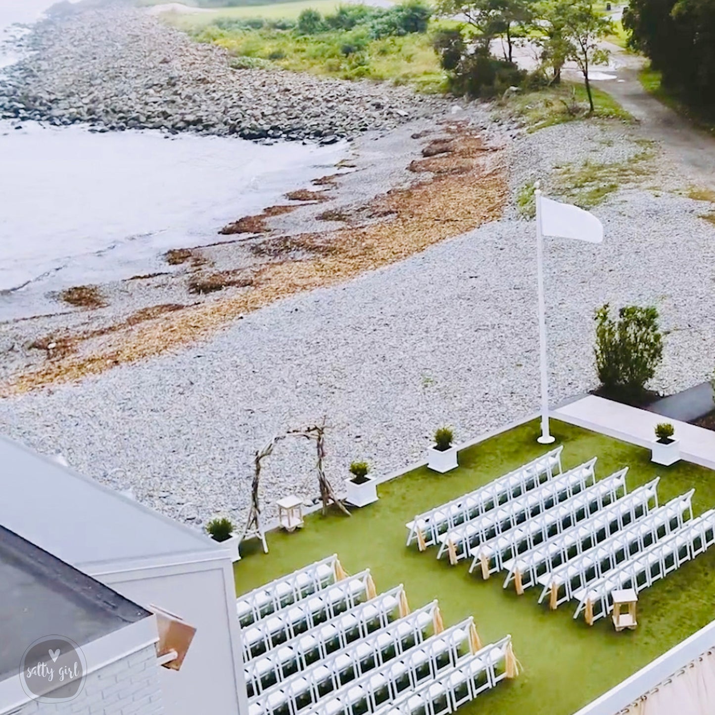 an aerial view of a wedding setup on the roof of a building