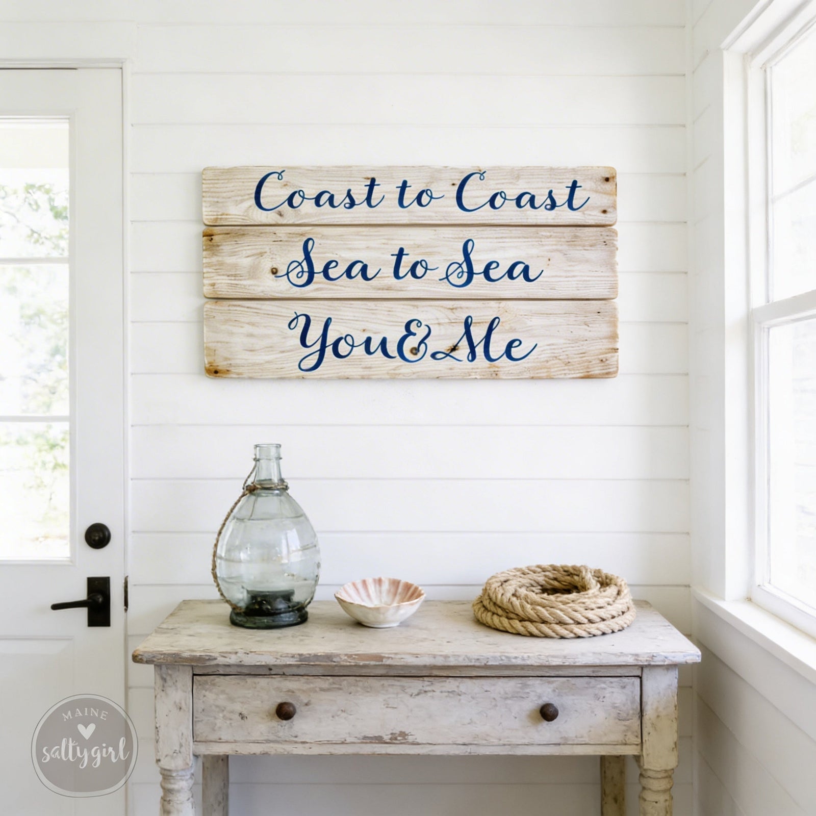 Driftwood Sign on white wall with coastal farmhouse decor