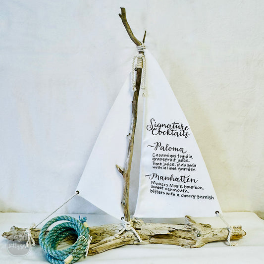 a small sailboat with a rope on top of it