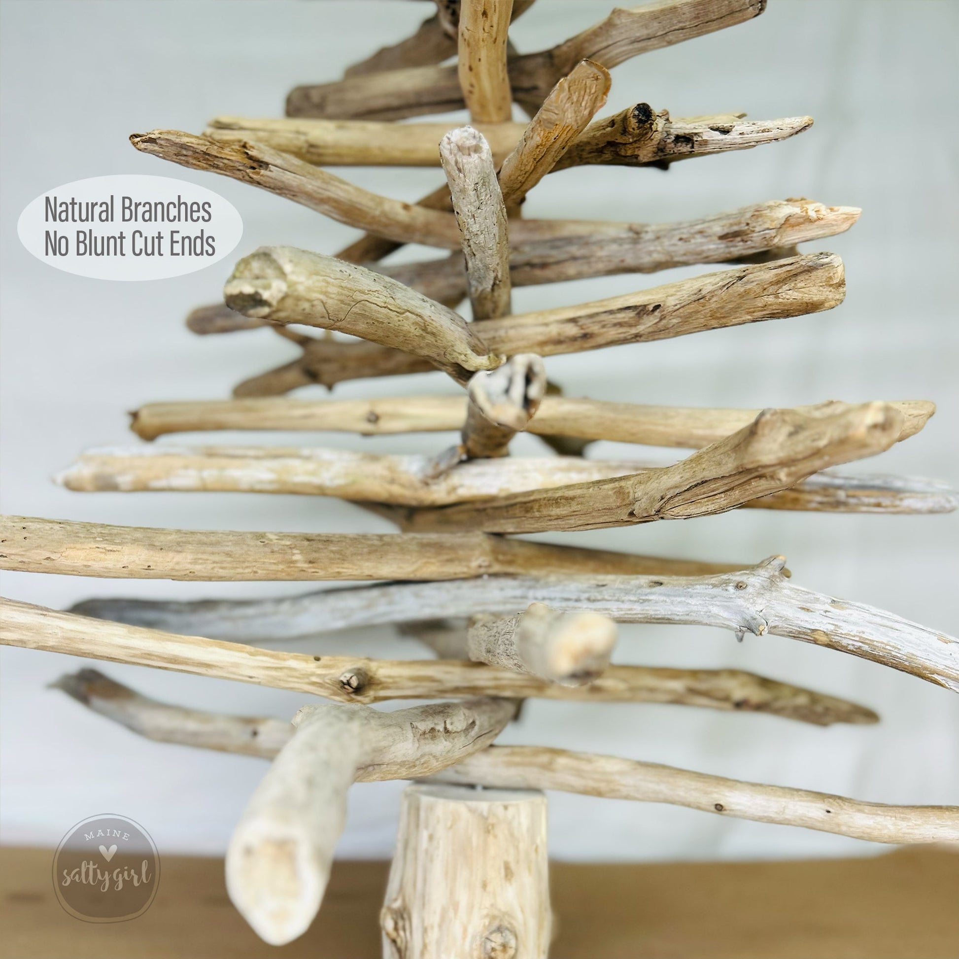 a collection of natural branches and sticks arranged in a unique and artistic manner, resembling a tree-like structure.