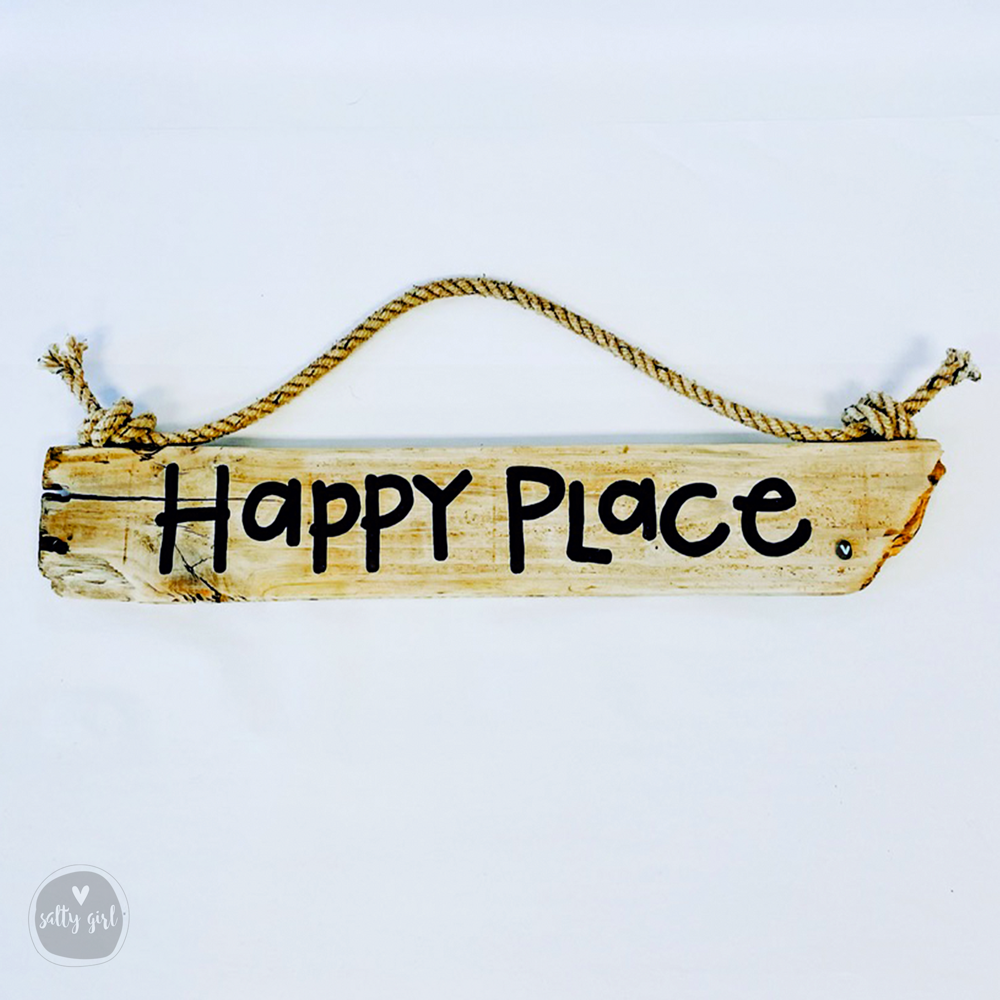 A wooden sign with the text "Happy Place" written on it, hanging from a rope.