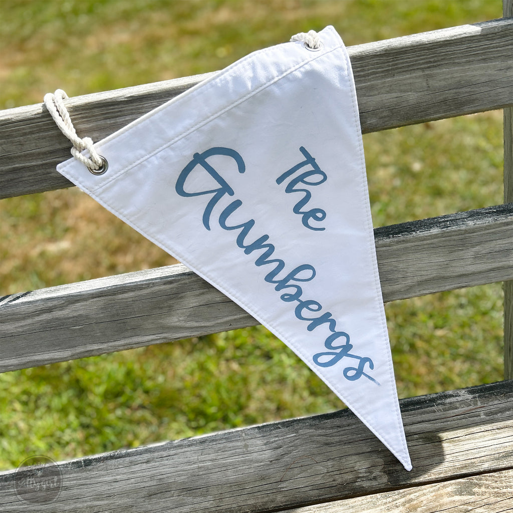 The Grumbergs Wedding Golf Flag draped on wooden bench