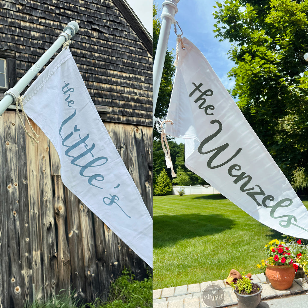 Personalized garden flags with 'the Little's' and 'the Wenzel's' text, one in front of a wooden barn and the other in a garden setting.