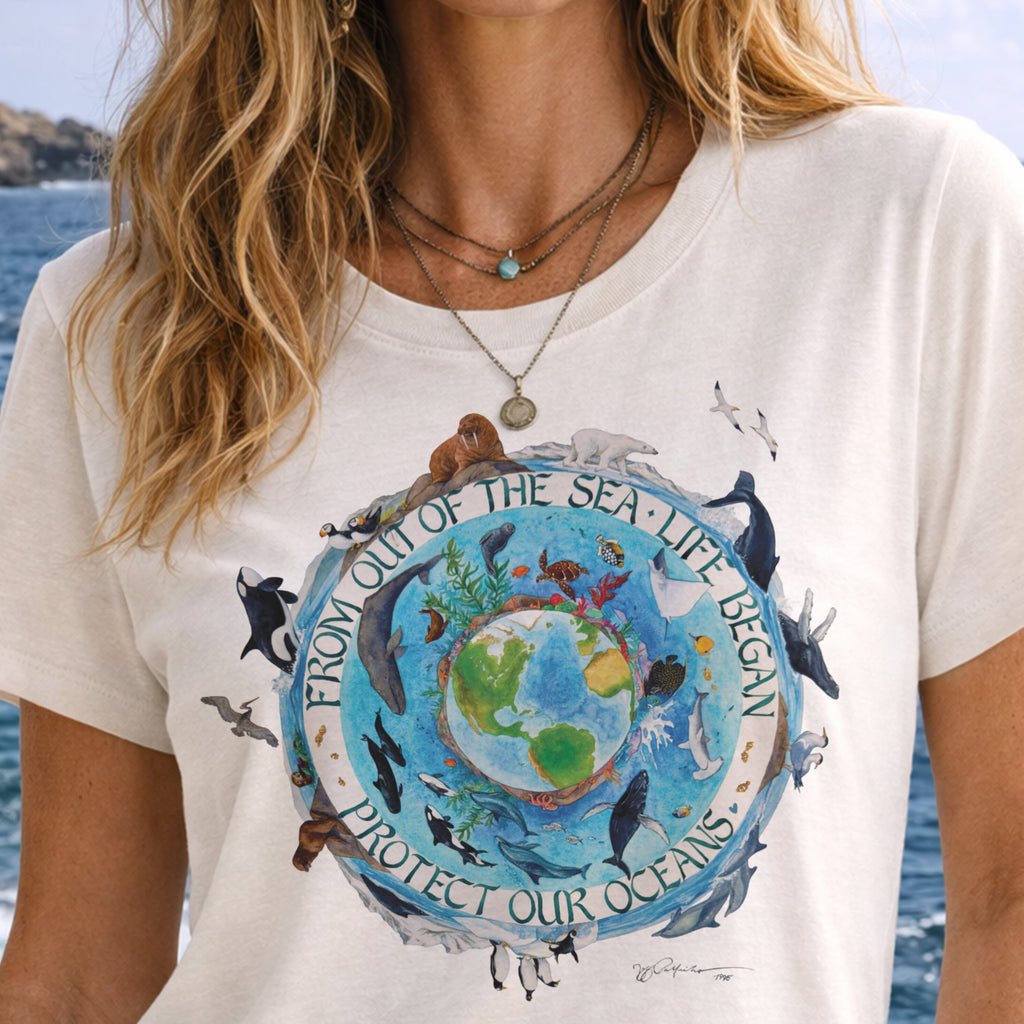 Person wearing a t-shirt with an ocean-themed design and text.