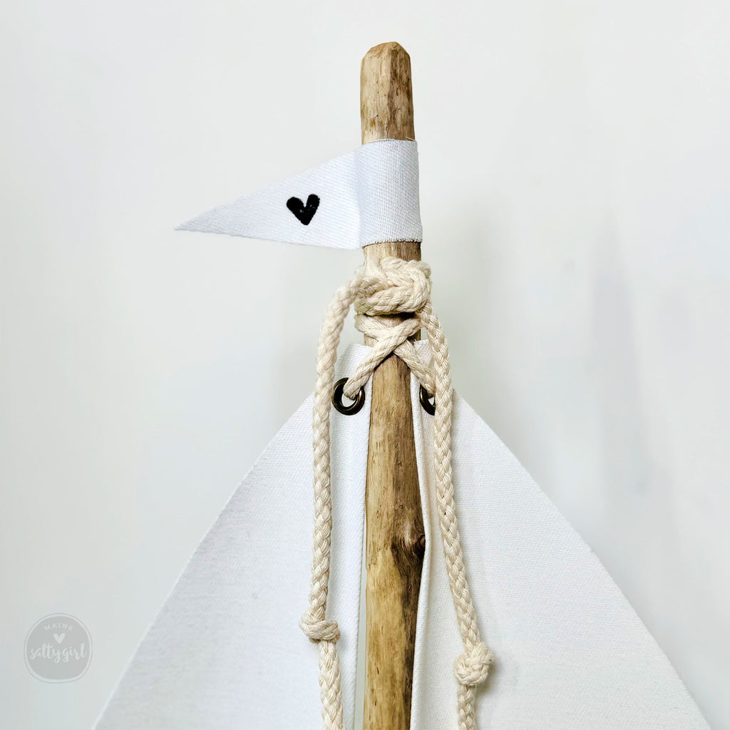 a wooden stick with a knot tied around it