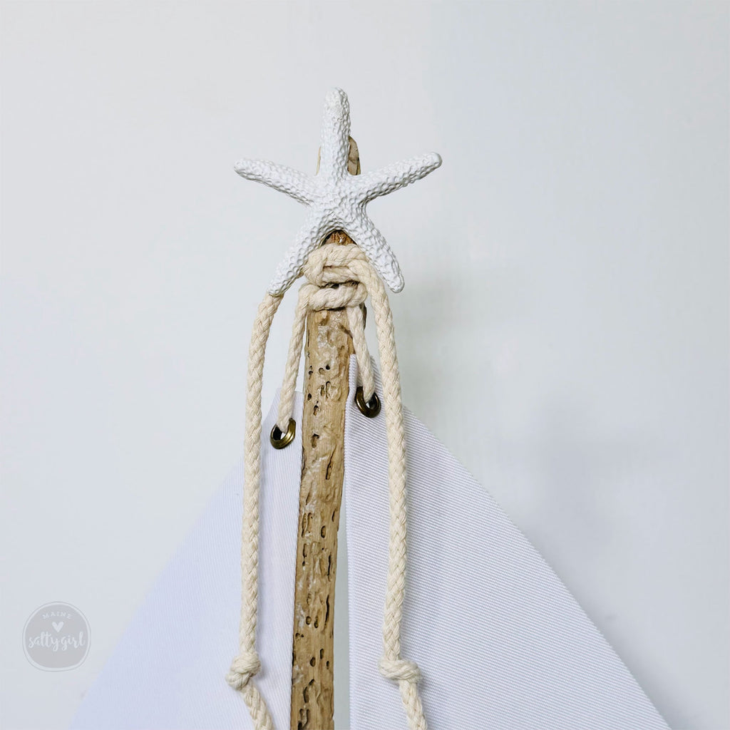 a wooden stick with a starfish on top of it