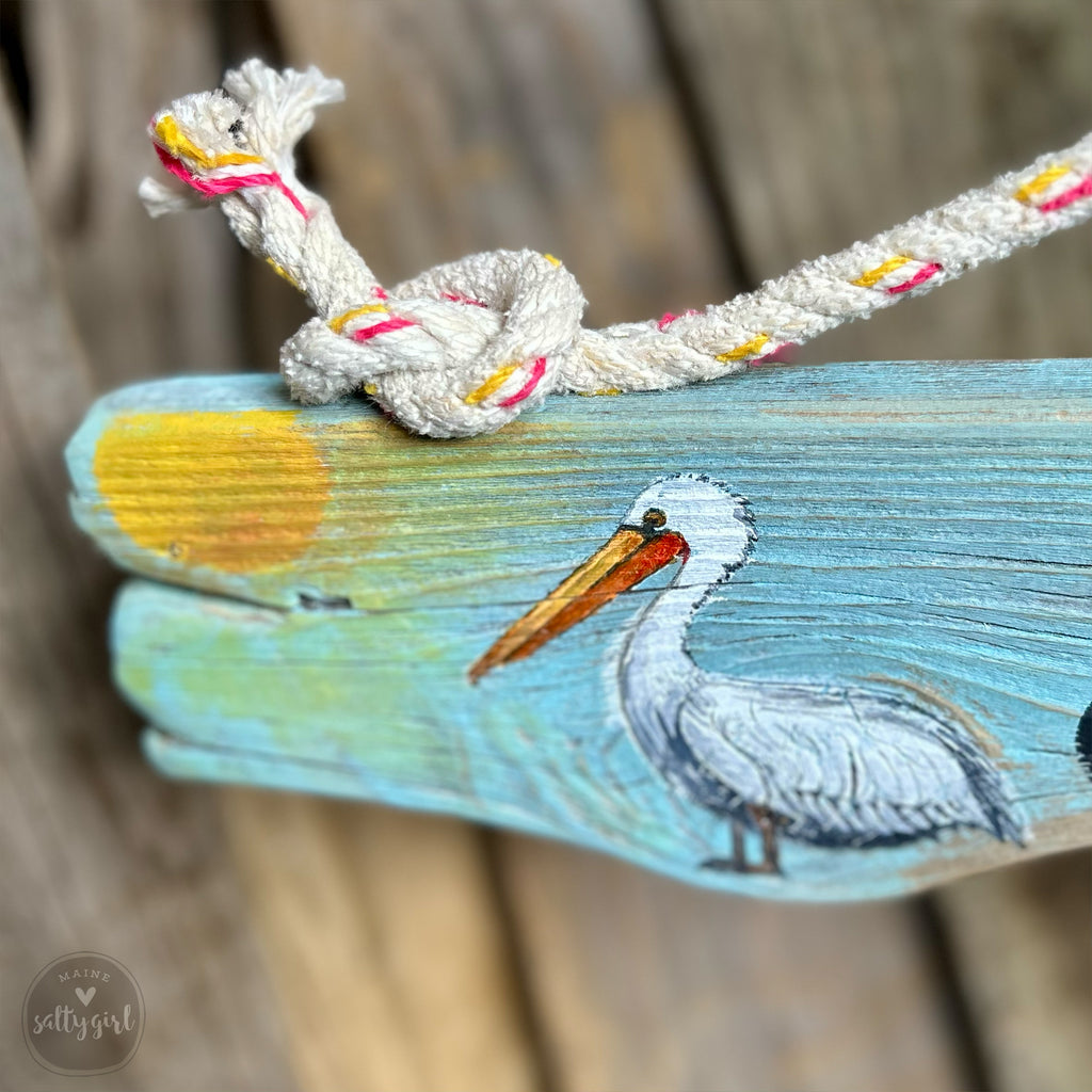a bird painted on a piece of wood