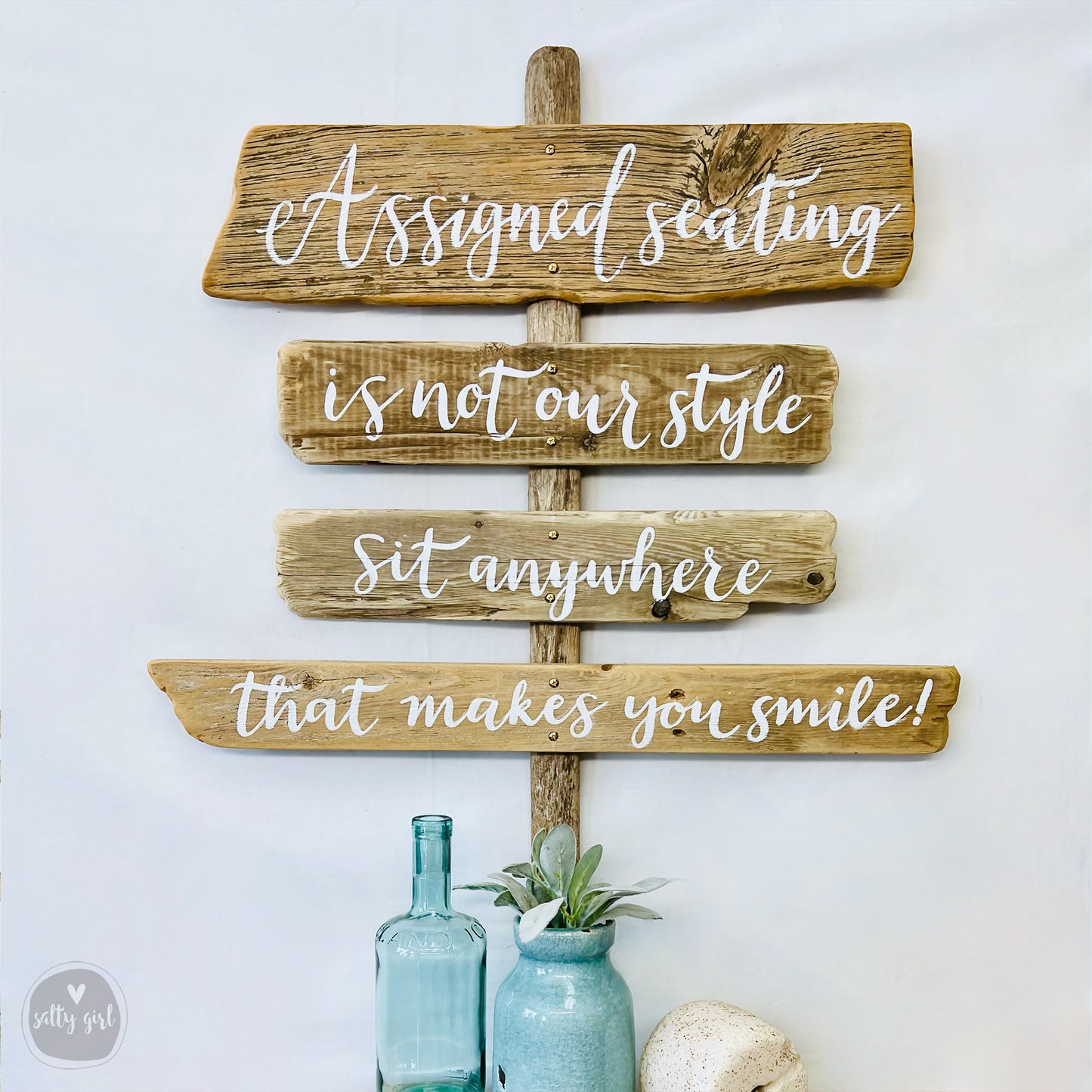 a wooden sign sitting on top of a shelf