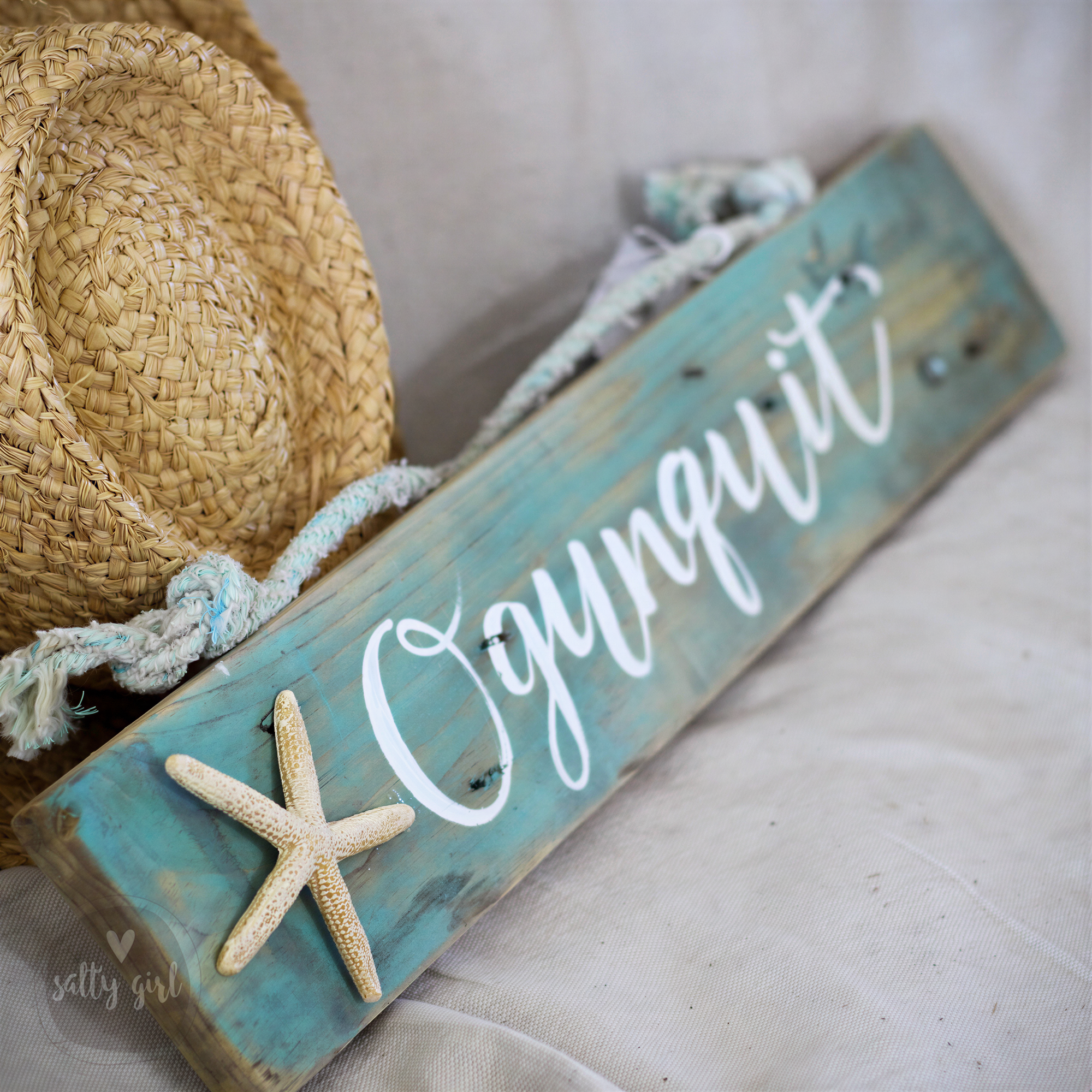 Hand-lettered Custom Driftwood Sign with Starfish featuring a white resin starfish and a rustic fishing rope hanger.