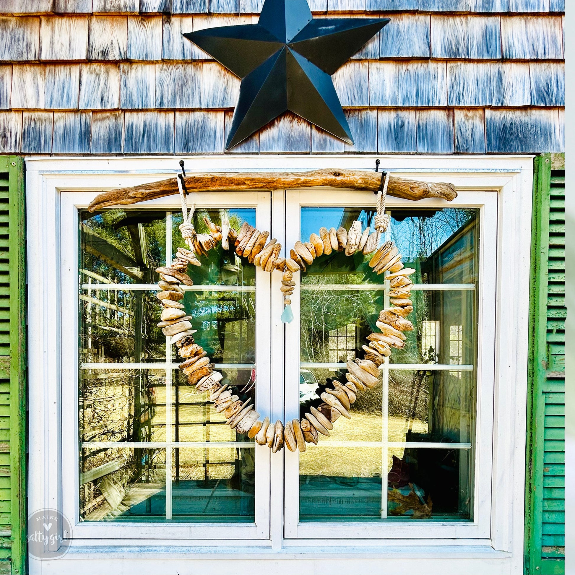 a star hanging on the side of a building