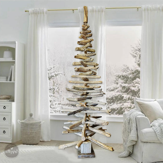 a christmas tree made out of driftwood in a living room