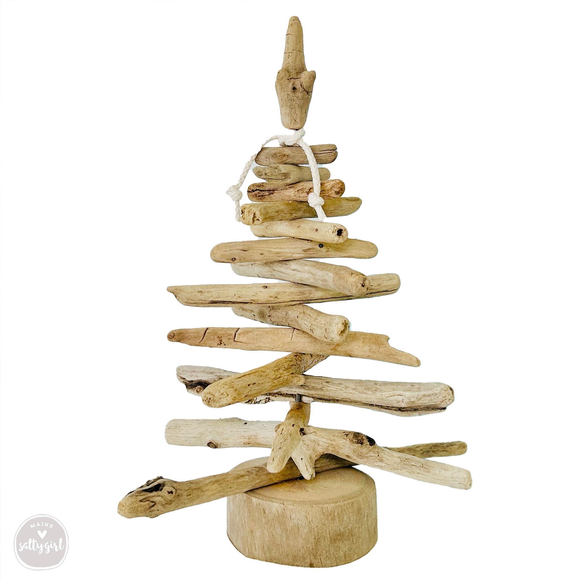 a wooden christmas tree made out of driftwood