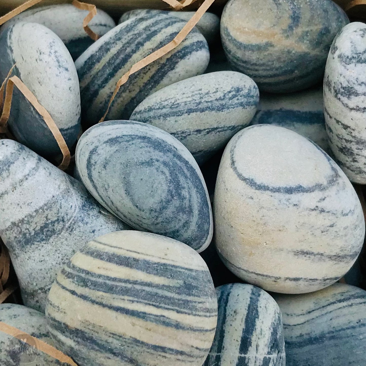 Close up of smooth striped beach stones